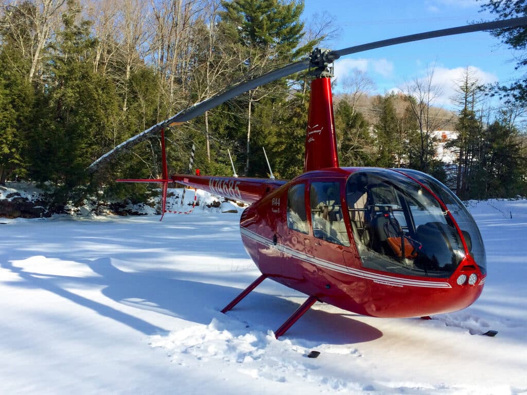 R44 helicopter landed in snow after a winter flight