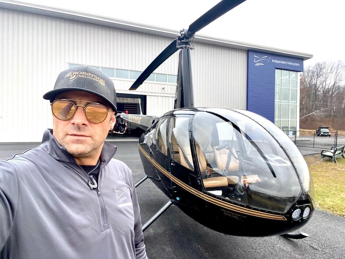 helicopter pilot selfie with R44 helicopter