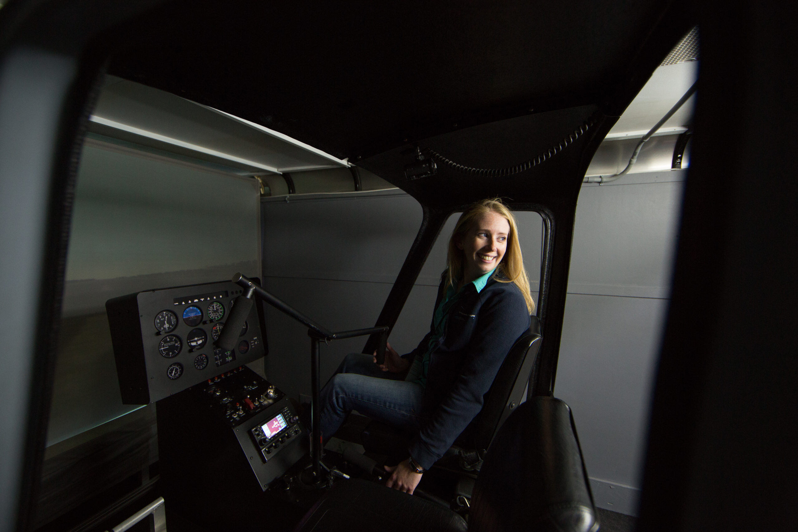 flight instructor demonstrating how to use the Frasca TruFlite H Helicopter FTD flight simulator